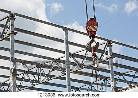 A crane hook attached to cables at a construction site View Large Photo Image Stock Photograph - A crane hook attached to cables at a construction site. Fotosearch