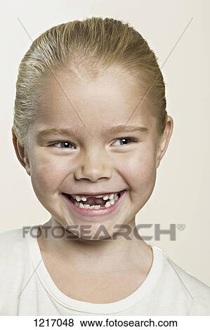 A cute laughing young girl View Large Photo Image Stock Photo - A cute laughing young girl. Fotosearch