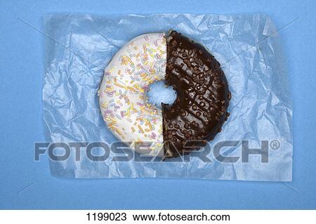 Stock Image - A donut made from two halves. Fotosearch