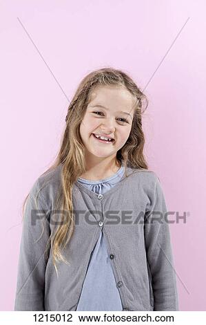 A girl grinning happily into the camera View Large Photo Image Stock Image - A girl grinning happily into the camera. Fotosearch