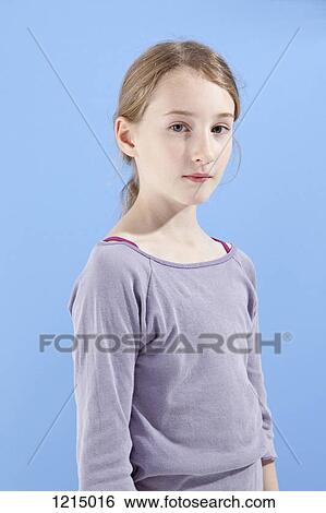 A girl looking seriously into the camera View Large Photo Image Stock Photograph - A girl looking seriously into the camera. Fotosearch