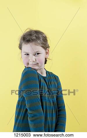 Stock Image - A girl posing playfully for the camera. Fotosearch