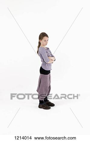 A girl with her arms crossed and looking away angrily View Large Photo Image Picture - A girl with her arms crossed and looking away angrily. Fotosearch