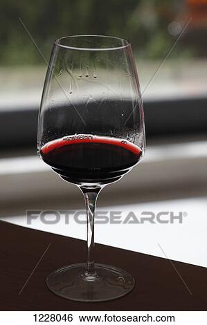A glass of red wine with wine legs View Large Photo Image Stock Photograph - A glass of red wine with wine legs. Fotosearch