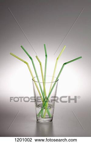 A glass with water in it and three green drinking straws and three yellow ones View Large Photo Image Stock Image - A glass with water in it and three green drinking straws and three yellow ones. Fotosearch