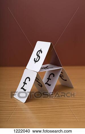 Stock Image - A house of cards of various currency. Fotosearch