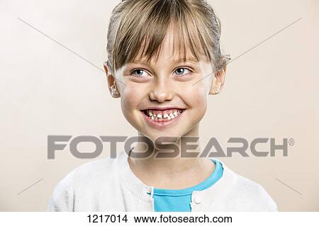 A laughing young girl looking away View Large Photo Image Picture - A laughing young girl looking away. Fotosearch