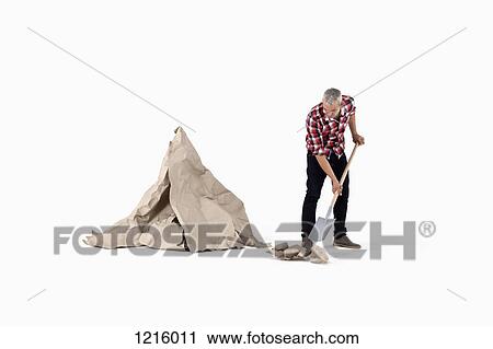 A man digging up construction paper rock, next to an artificial paper boulder View Large Photo Image Stock Image - A man digging up construction paper rock, next to an artificial paper boulder. Fotosearch