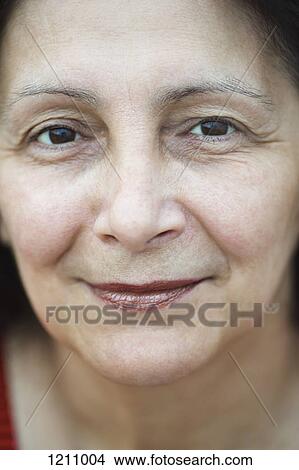 Picture - A mature woman looking tranquil, close-up. Fotosearch