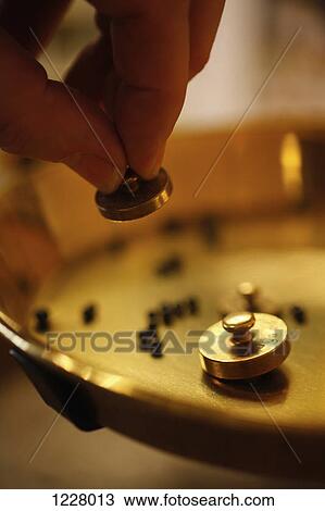 A perfumer using small weights at perfumery View Large Photo Image Stock Image - A perfumer using small weights at perfumery. Fotosearch