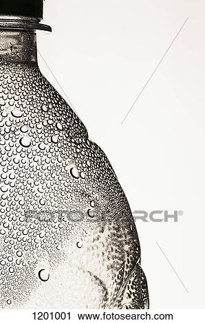 Stock Image - A plastic water bottle with condensation on it. Fotosearch