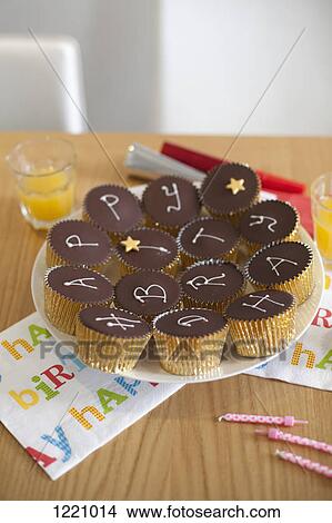 Picture - A plate of cupcakes with Happy Birthday written on them. Fotosearch