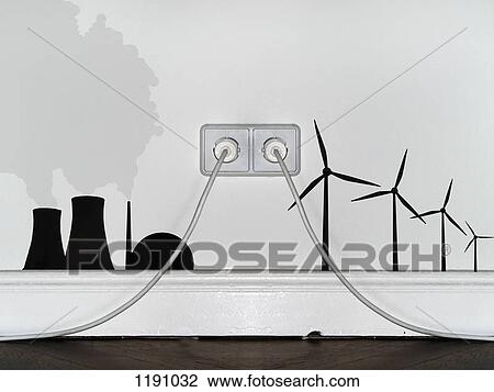 Stock Image - A plug in an outlet in between decals of wind turbines and a nuclear power station. Fotosearch