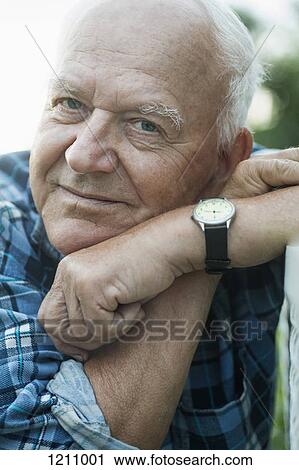 Stock Image - A senior man looking relaxed, close-up. Fotosearch