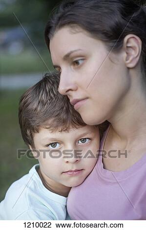 A serene mother and her affectionate son View Large Photo Image Stock Image - A serene mother and her affectionate son. Fotosearch