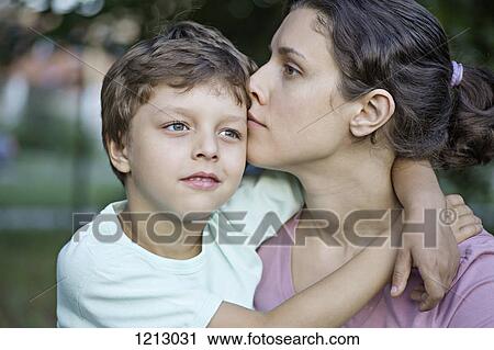 A serene mother and her affectionate son View Large Photo Image Stock Image - A serene mother and her affectionate son. Fotosearch