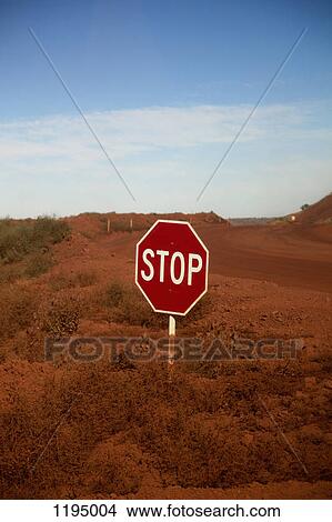 A stop sign at an intersection in a desert View Large Photo Image Picture - A stop sign at an intersection in a desert. Fotosearch