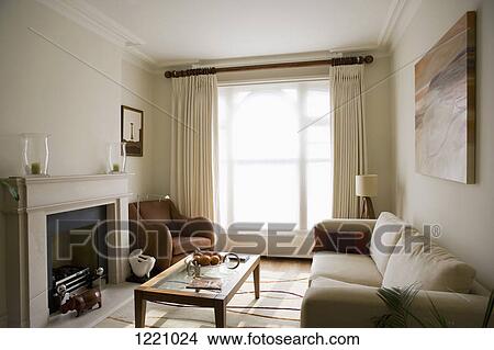 A sunlight shining on a modern living room View Large Photo Image Picture - A sunlight shining on a modern living room. Fotosearch