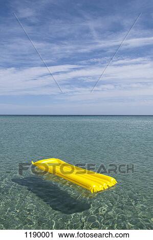 A yellow inflatable raft floating on the sea, Budoni, Sardinia, Italy View Large Photo Image Stock Image - A yellow inflatable raft floating on the sea, Budoni, Sardinia, Italy. Fotosearch