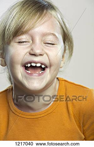 A young girl laughing joyously View Large Photo Image Stock Image - A young girl laughing joyously. Fotosearch