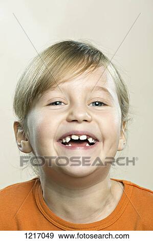 A young girl laughing joyously View Large Photo Image Stock Photo - A young girl laughing joyously. Fotosearch