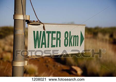 Stock Image - An arrow sign for WATER in 8km. Fotosearch