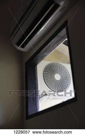 An electric fan seen through a window, low angle view View Large Photo Image Stock Photo - An electric fan seen through a window, low angle view. Fotosearch