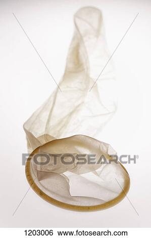 Stock Photograph - An empty used condom. Fotosearch