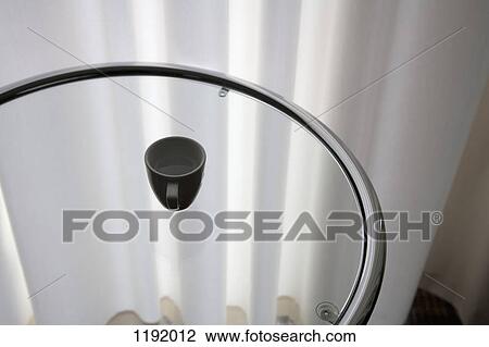 An espresso cup on a glass table View Large Photo Image Stock Image - An espresso cup on a glass table. Fotosearch