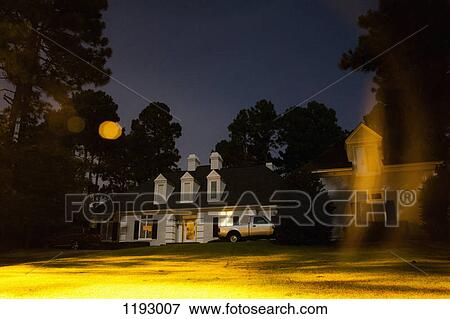 An illuminated house at night, long exposure View Large Photo Image Stock Photo - An illuminated house at night, long exposure. Fotosearch