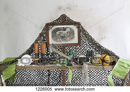 An old photograph of a tiger surrounded by an adventurer's equipment View Large Photo Image Stock Photography - An old photograph of a tiger surrounded by an adventurer's equipment. Fotosearch