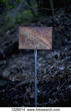 An old rusty sign with a skull and crossbones on it posted outdoors View Large Photo Image Picture - An old rusty sign with a skull and crossbones on it posted outdoors. Fotosearch