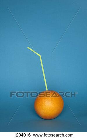 An orange with a drinking straw stuck in it View Large Photo Image Stock Photograph - An orange with a drinking straw stuck in it. Fotosearch