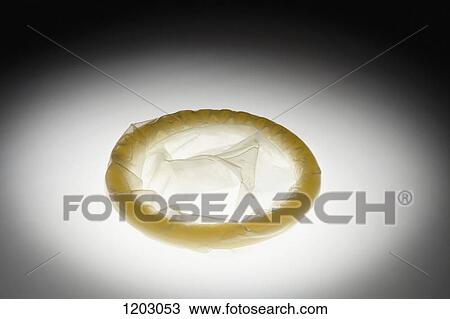 An unused, rolled up condom, spot lit View Large Photo Image Stock Image - An unused, rolled up condom, spot lit. Fotosearch