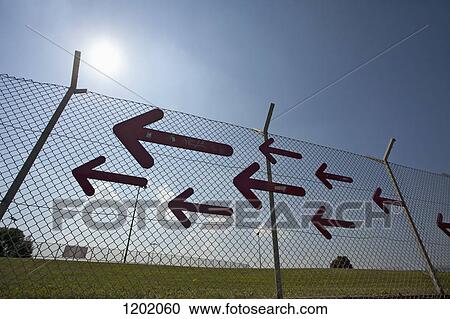 Arrows on fence View Large Photo Image Stock Image - Arrows on fence. Fotosearch