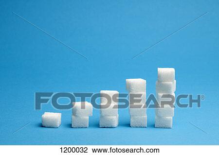 Stock Image - Ascending stacks of sugar cubes. Fotosearch