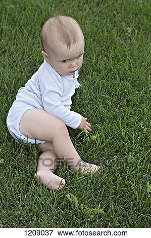 Stock Photo - Baby in the garden. Fotosearch