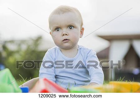 Baby in the garden View Large Photo Image Stock Photography - Baby in the garden. Fotosearch