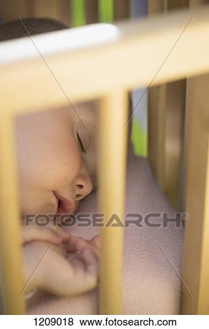 Baby seeping in crib outside View Large Photo Image Stock Photo - Baby seeping in crib outside. Fotosearch