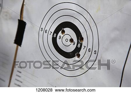 Bullet holes on a paper target View Large Photo Image Stock Photo - Bullet holes on a paper target. Fotosearch