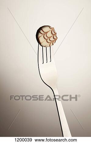 Stock Photo - Candy treat on fork. Fotosearch
