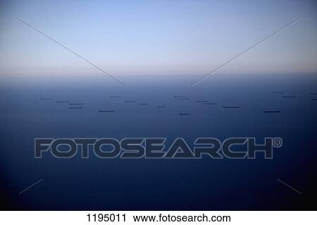 Stock Image - Cargo ships out at sea. Fotosearch