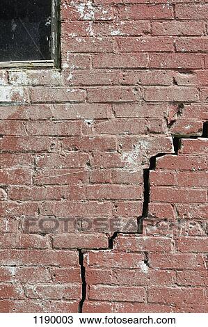 Close-up of a crack running through a red brick wall View Large Photo Image Stock Image - Close-up of a crack running through a red brick wall. Fotosearch