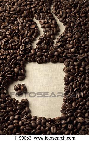Stock Image - Coffee beans arranged as a cup of coffee. Fotosearch