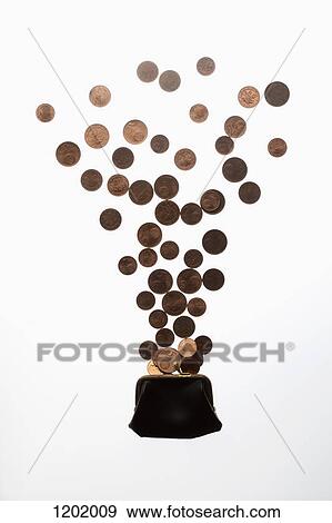 Coins falling into purse View Large Photo Image Stock Photo - Coins falling into purse. Fotosearch