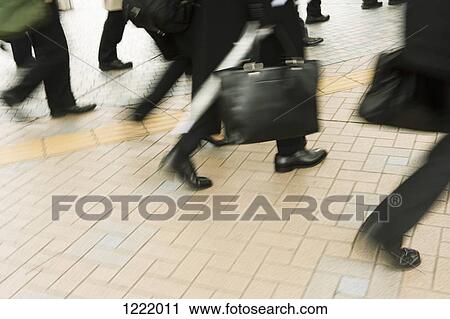 Stock Image - Commuters on the move. Fotosearch