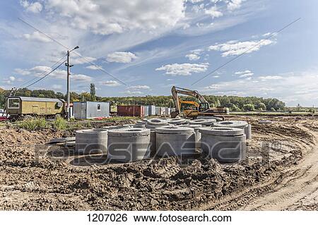 Concrete cylinders on construction site View Large Photo Image Stock Photograph - Concrete cylinders on construction site. Fotosearch