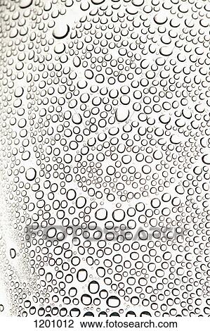Stock Image - Condensation on a shiny surface making an abstract pattern. Fotosearch