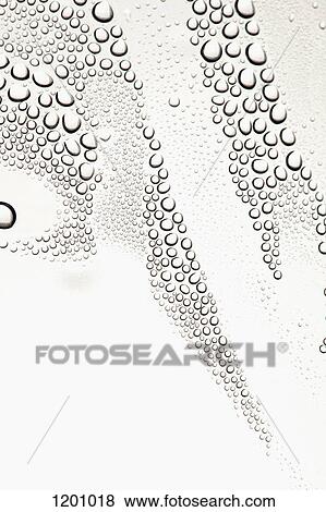 Condensation on a shiny surface making an abstract pattern View Large Photo Image Stock Photo - Condensation on a shiny surface making an abstract pattern. Fotosearch