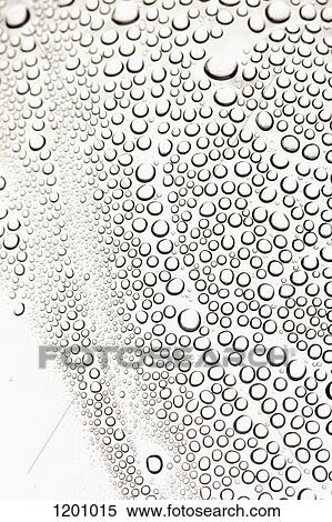 Stock Photography - Condensation on a shiny surface making an abstract pattern. Fotosearch
